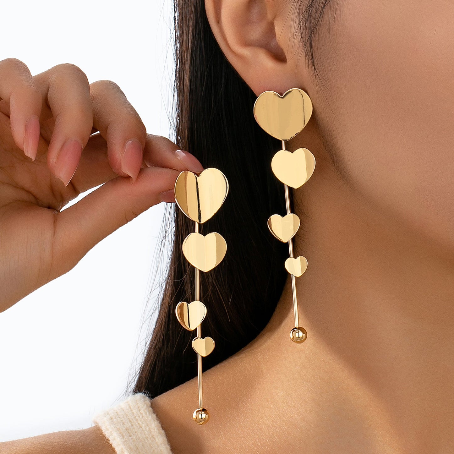 Aretes Cascada de Corazones Dorados