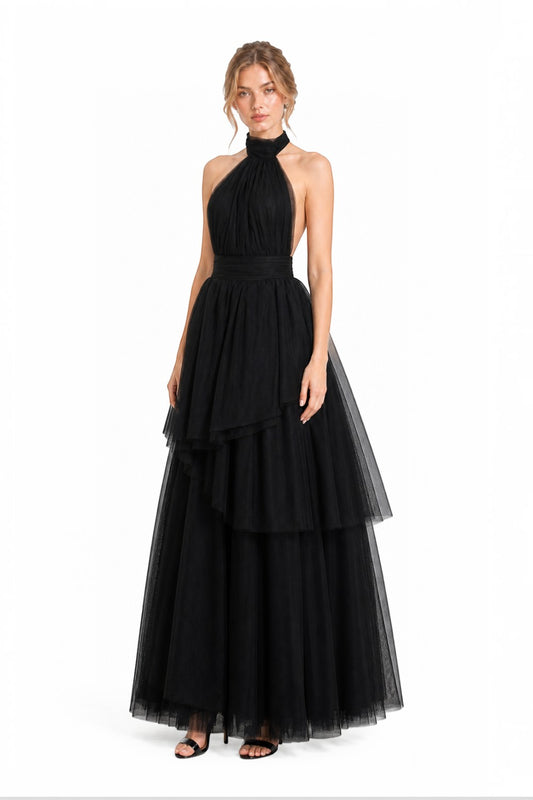 Pink shop by maf black tulle halter gown with tiered skirt and bow neck detail worn by a model