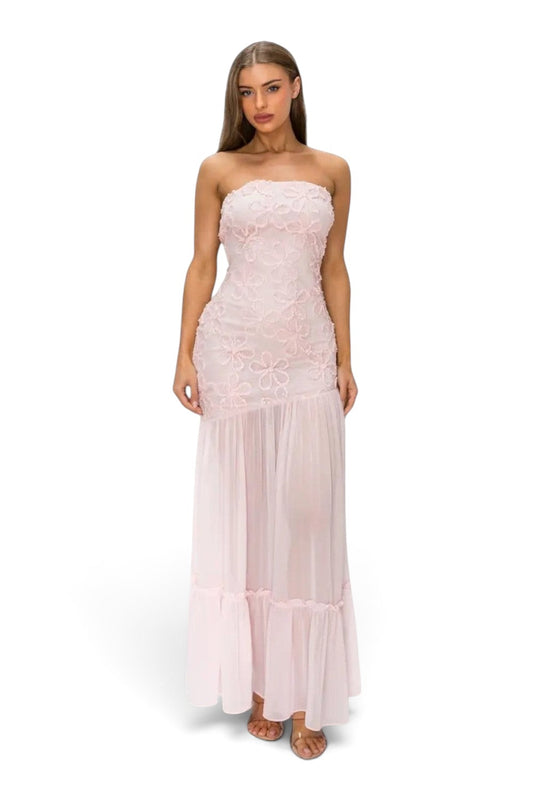 Model wearing a Pink shop by maf blush pink strapless midi dress with 3D floral lace bodice and sheer mesh skirt.