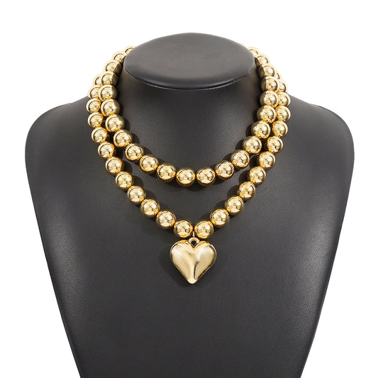 Collar Doble Esferas con Corazón Dorado