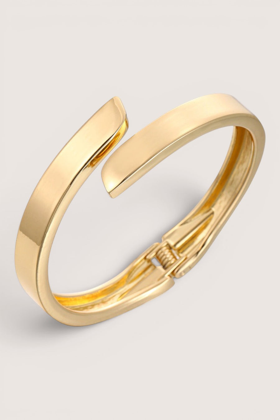 Brazalete Rígido Cruzado Dorado Pulido