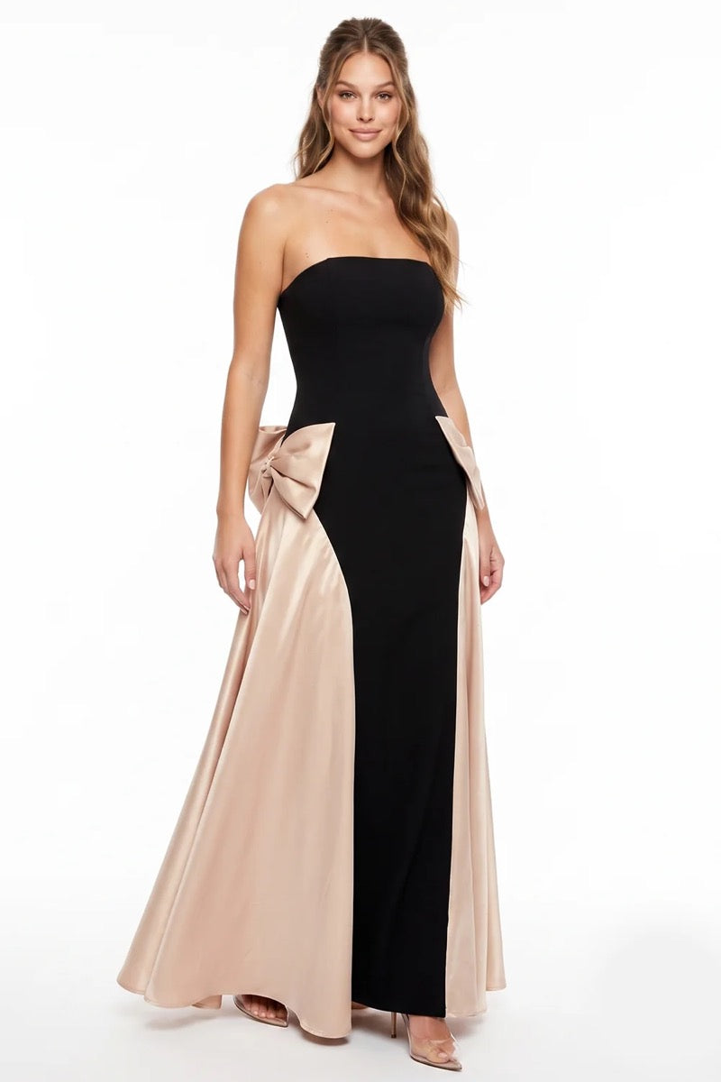 Vestido largo negro strapless moños champagne — detalle