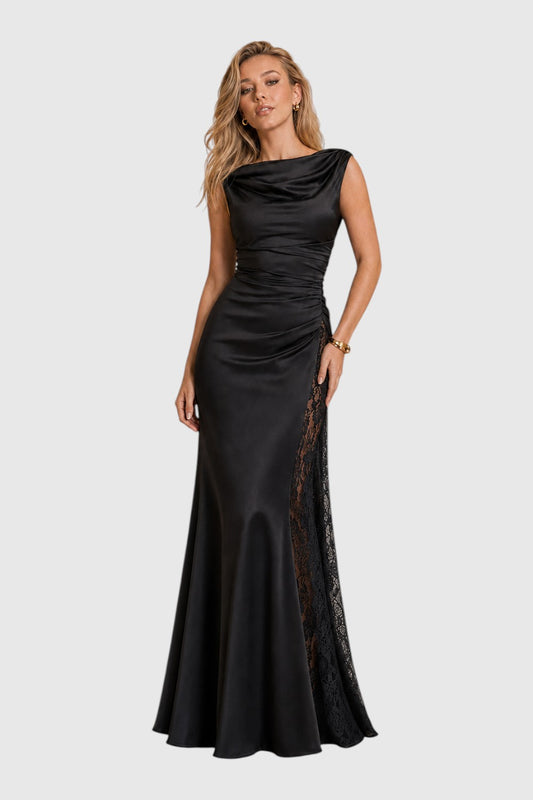 Model wearing a Pink shop by maf black satin floor-length evening gown with a draped neckline and lace side panel.