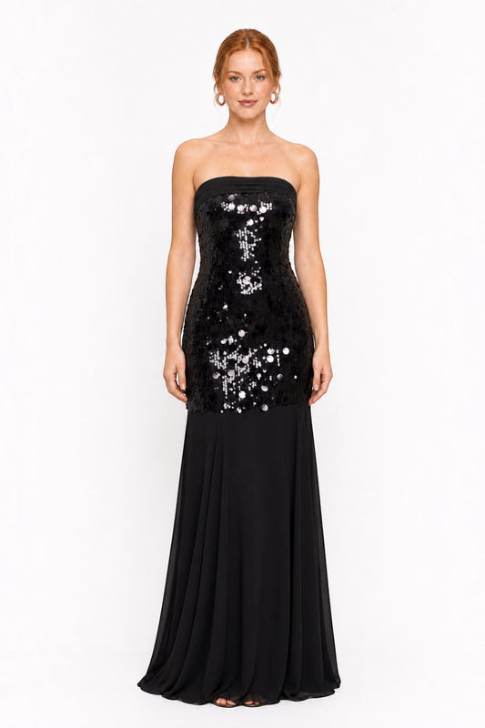 Pink shop by maf black strapless mermaid gown with sequin bodice and flowing chiffon skirt on a model