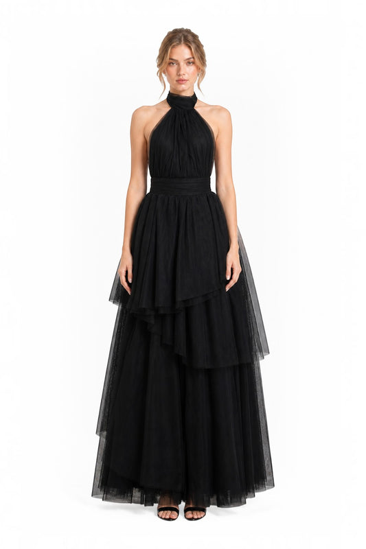 Pink shop by maf black tulle halter gown with tiered asymmetrical skirt and bow neck detail on a model