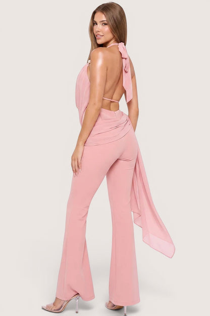 Pink shop by maf bridal pink halter jumpsuit with cowl neck, open back, pearl straps, and flowing bow detail.