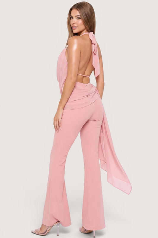 Pink shop by maf bridal pink halter jumpsuit with cowl neck, open back, pearl straps, and flowing bow detail.