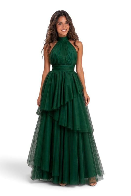 Model wearing a Pink shop by maf forest green tulle halter gown with a bow neck and asymmetrical tiered skirt.