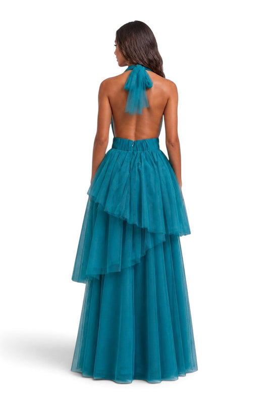 Pink shop by maf teal tulle halter gown with an open back and tiered peplum skirt on a model, back view.
