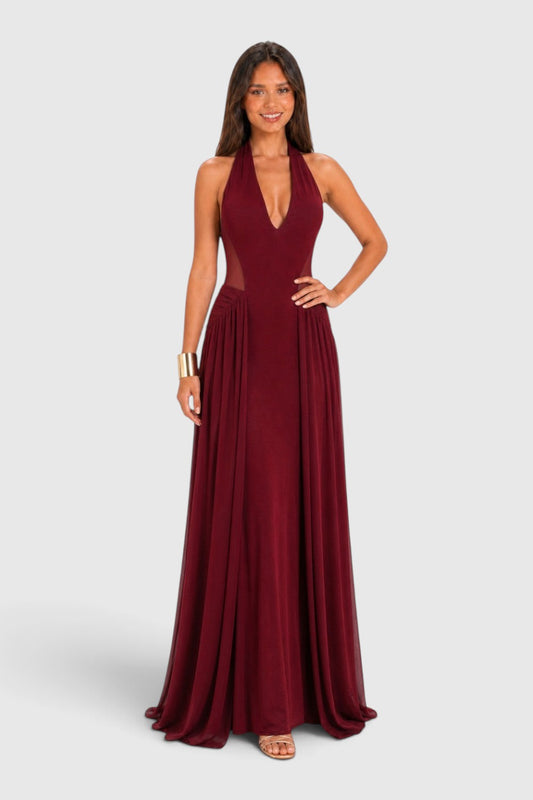 Pink shop by maf wine red maxi dress with halter neckline, mesh waist panels, and flowing skirt on a model