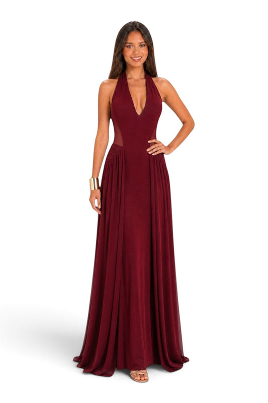 Pink shop by maf wine red maxi dress with halter neckline, mesh side panels, and flowing skirt on a smiling model