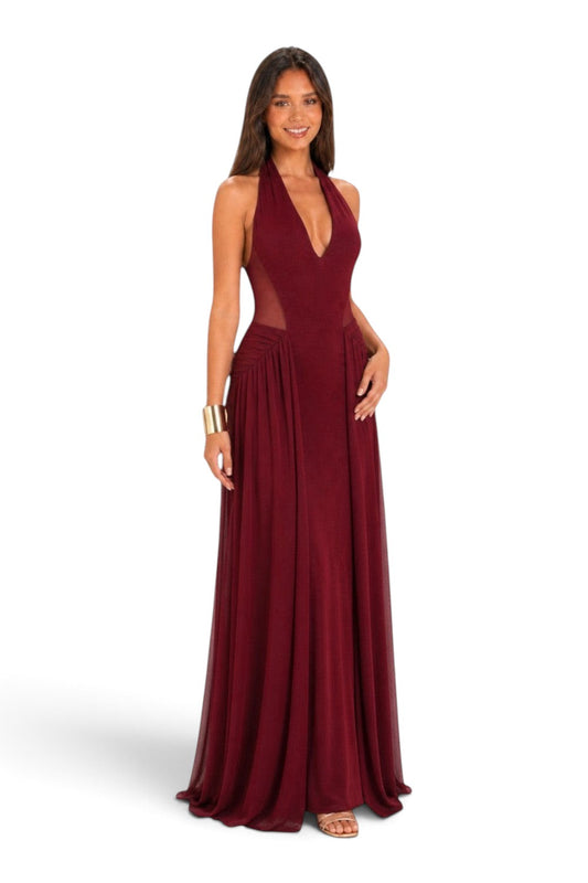 Pink shop by maf wine red maxi dress with halter neckline, mesh side panels, and flowing skirt on a model