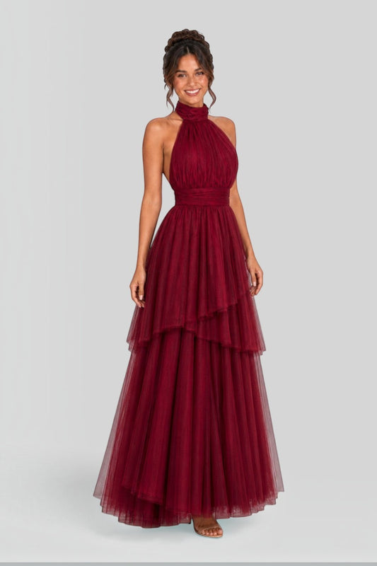 Pink shop by maf wine red tulle halter gown with tiered skirt and bow neck detail worn by a model