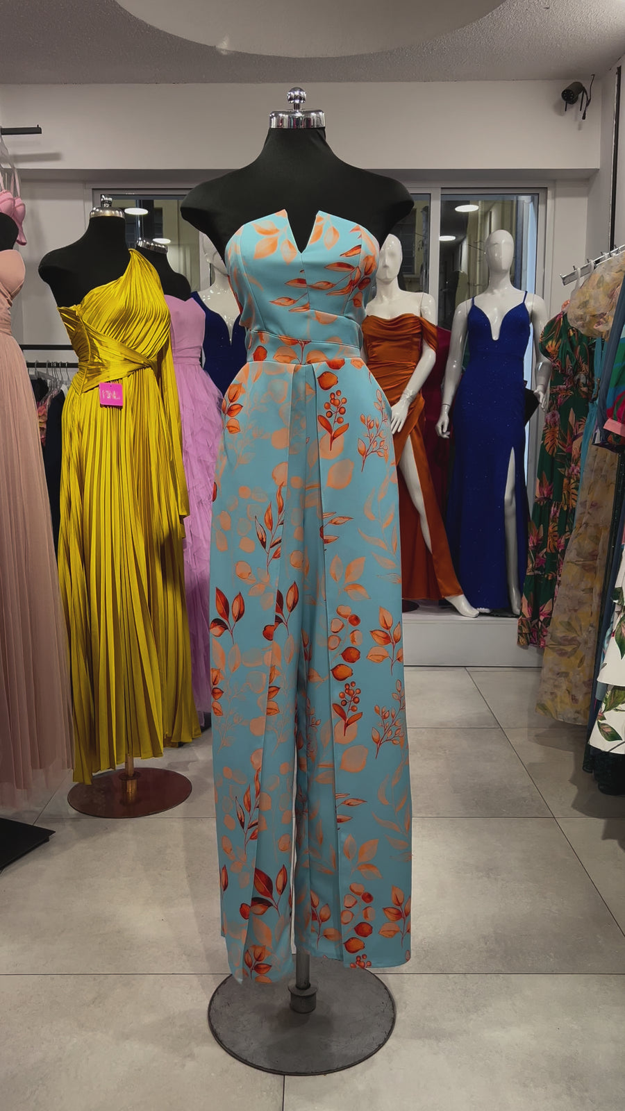 Jumpsuit aberturas strapless azul flores naranja